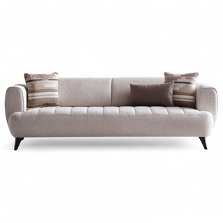 Gray sofa with patterned cushions on a white background