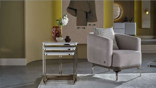 Two-piece wooden nesting tables with curved edges.