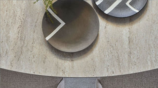 Two decorative bowls with white arrow designs on a textured surface.