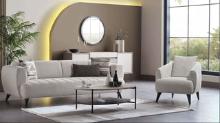 Modern living room with a gray sofa, armchair, and coffee table.