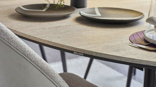 Elegant dining table with plates and a chair