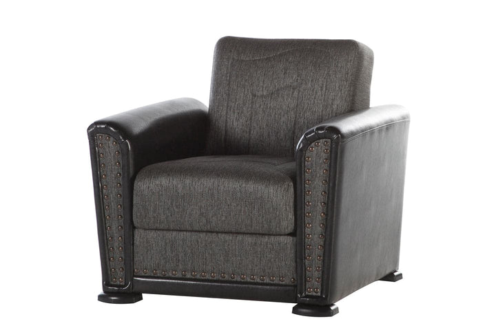 Refined Alfa armchair with round arms and unique stitching.
