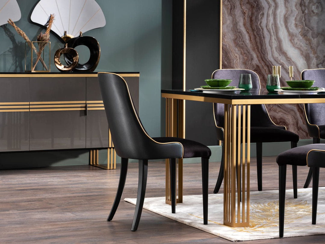 Sleek Carlino dining table with marble finish and gold metal legs.