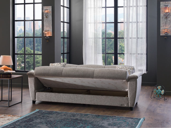 Sleek Aspen armchair featuring soft curves and subtle detailing.